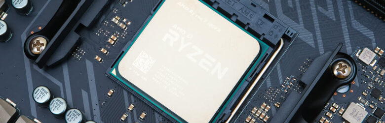 AMD Ryzen processor CPU chip on dark background showing pins