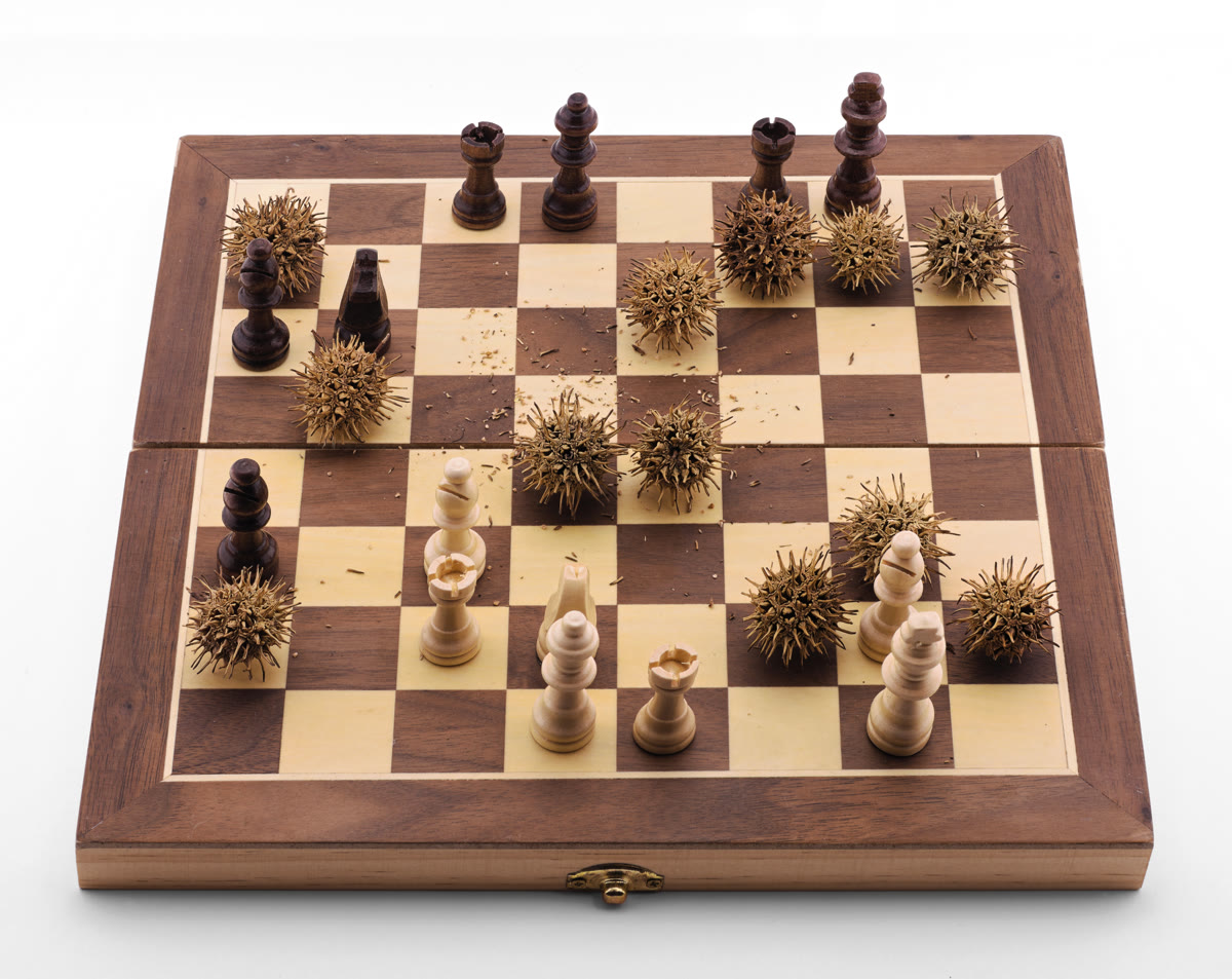 Chess pieces arranged on a battlefield-style board representing the strategic competition for AI talent