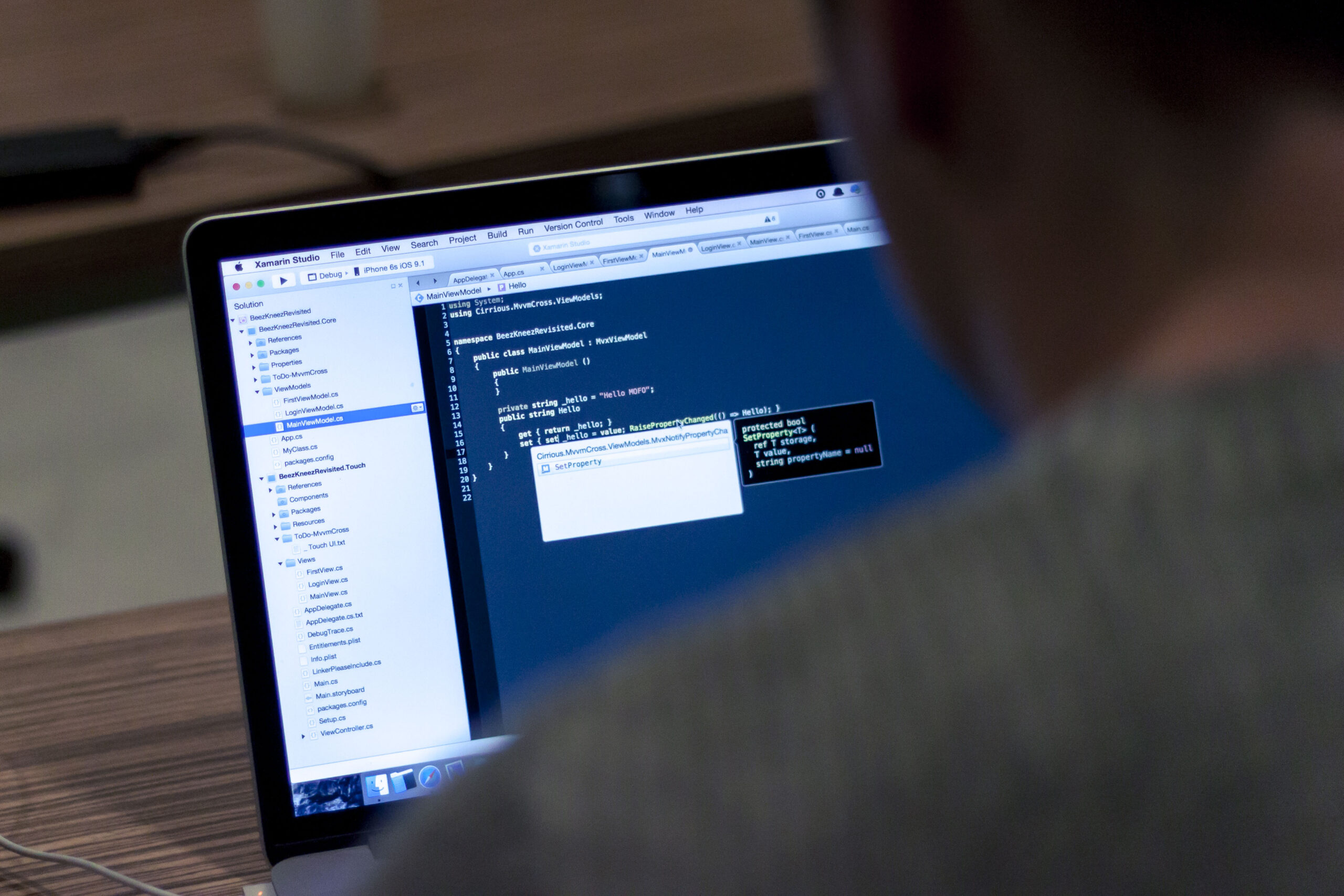Laptop computer displaying programming code on screen