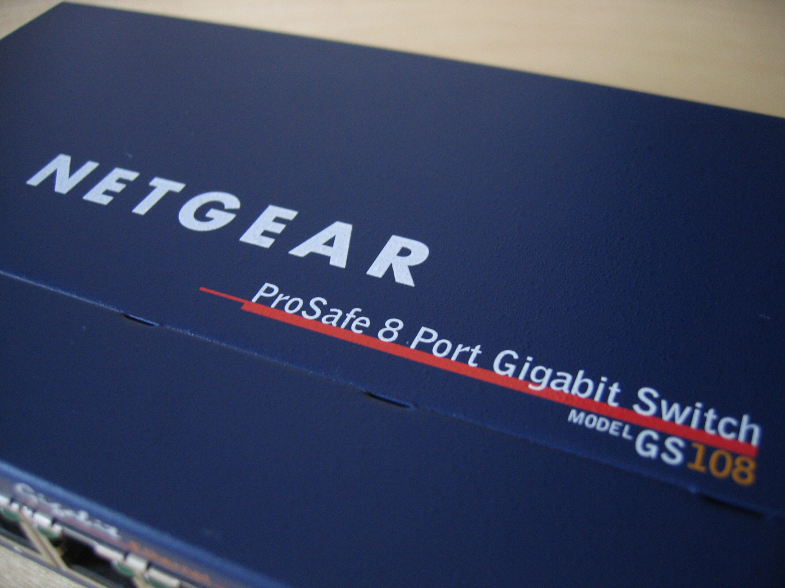 Close-up of a Netgear Prosafe GS108 Gigabit Ethernet switch with connected cables