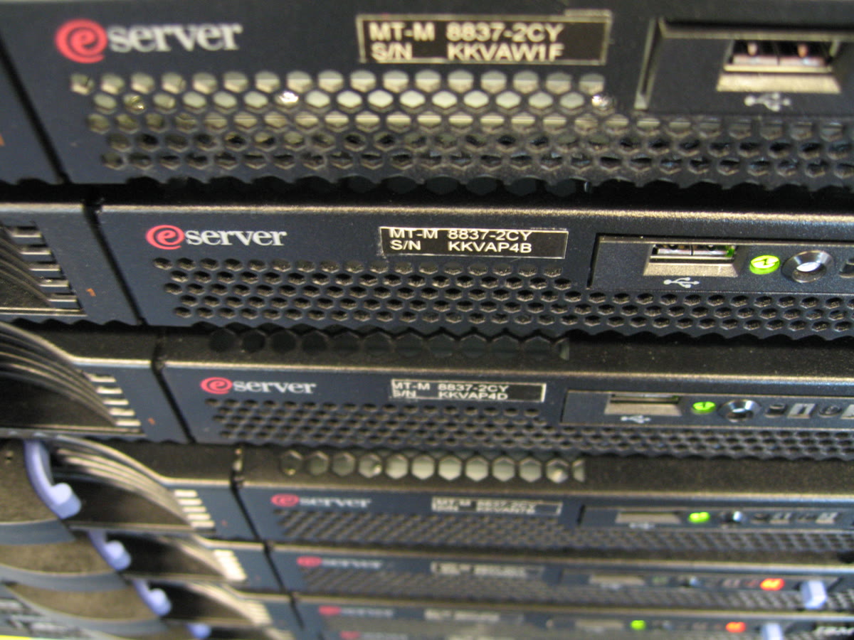 Close-up of an IBM eServer rack showing enterprise server hardware and networking equipment