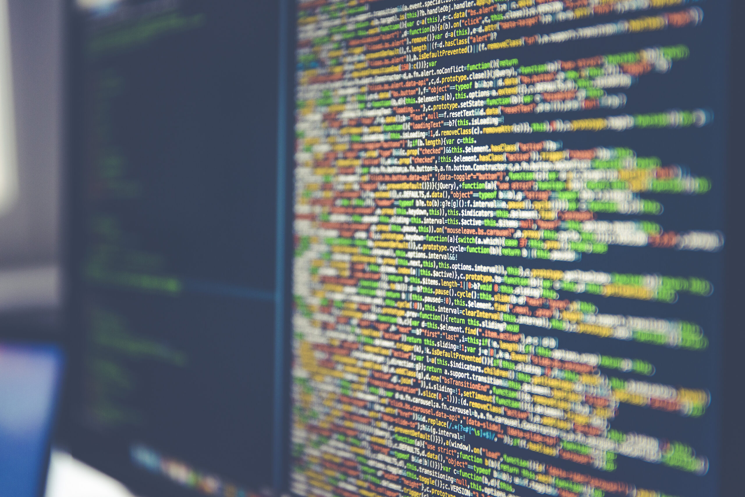 Code on a computer monitor representing C programming and safe string handling
