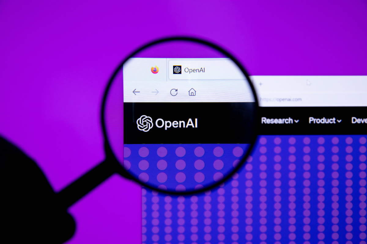 OpenAI logo viewed through a magnifying glass representing security scrutiny