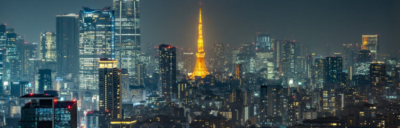 Tokyo Tower and city skyline at night representing Sakana AI's Tokyo headquarters