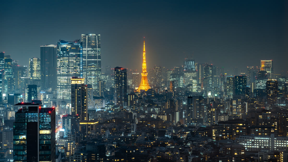 Tokyo Tower and city skyline at night representing Sakana AI's Tokyo headquarters