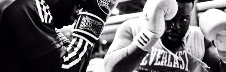 Boxing ring setup with gloves and equipment in France at Boxing Beats event