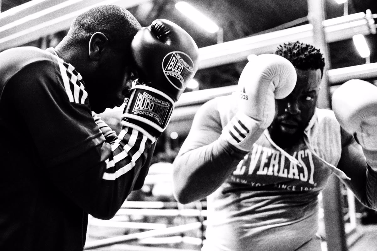 Boxing ring setup with gloves and equipment at Boxing Beats event in Aubervilliers, France