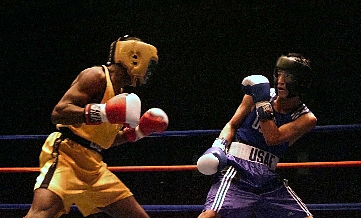 Two boxers in the ring at the Armed Forces Boxing Competition