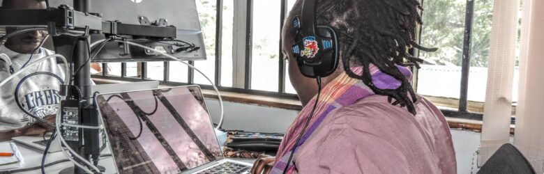 A software developer working at a desk with a laptop, representing the developer workspace where MCP servers are built
