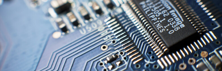 Close-up of a computer circuit board representing AI chip technology and semiconductor innovation
