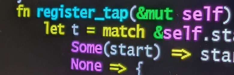Rust programming code displayed on a computer monitor, representing the Rust programming language used in the Linux 0.11 kernel rewrite