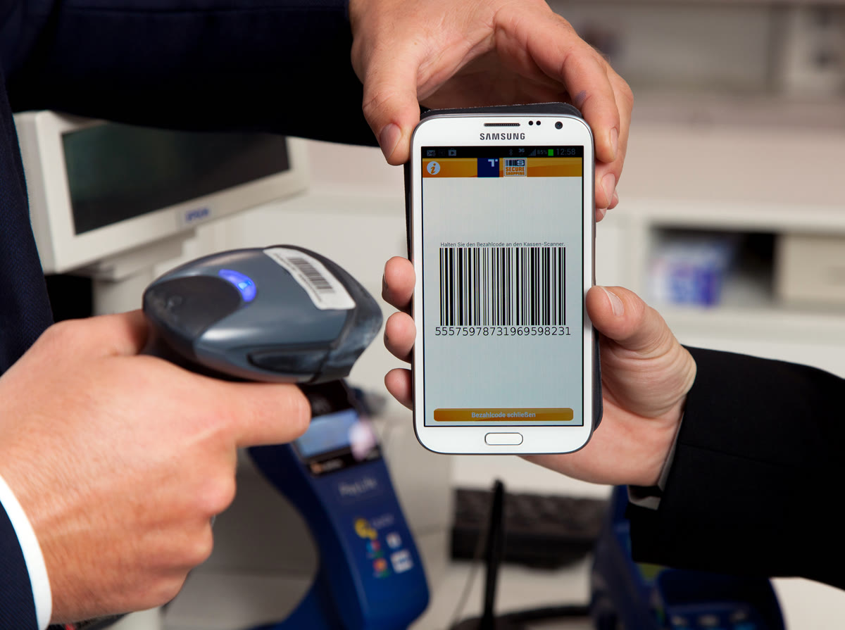 Person holding smartphone with mobile payment app displayed