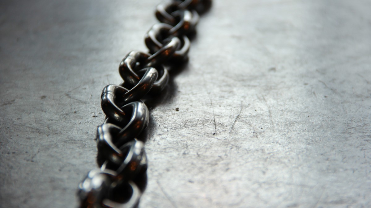 Close-up of metal chain links, representing the mold linker joining object files into an executable