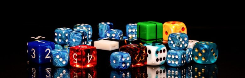 Scattered dice representing random number generation and weak randomness in JavaScript cryptography