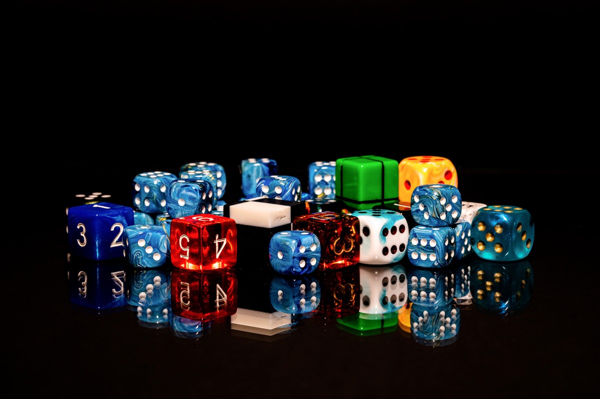 Scattered dice representing random number generation and weak randomness in JavaScript cryptography