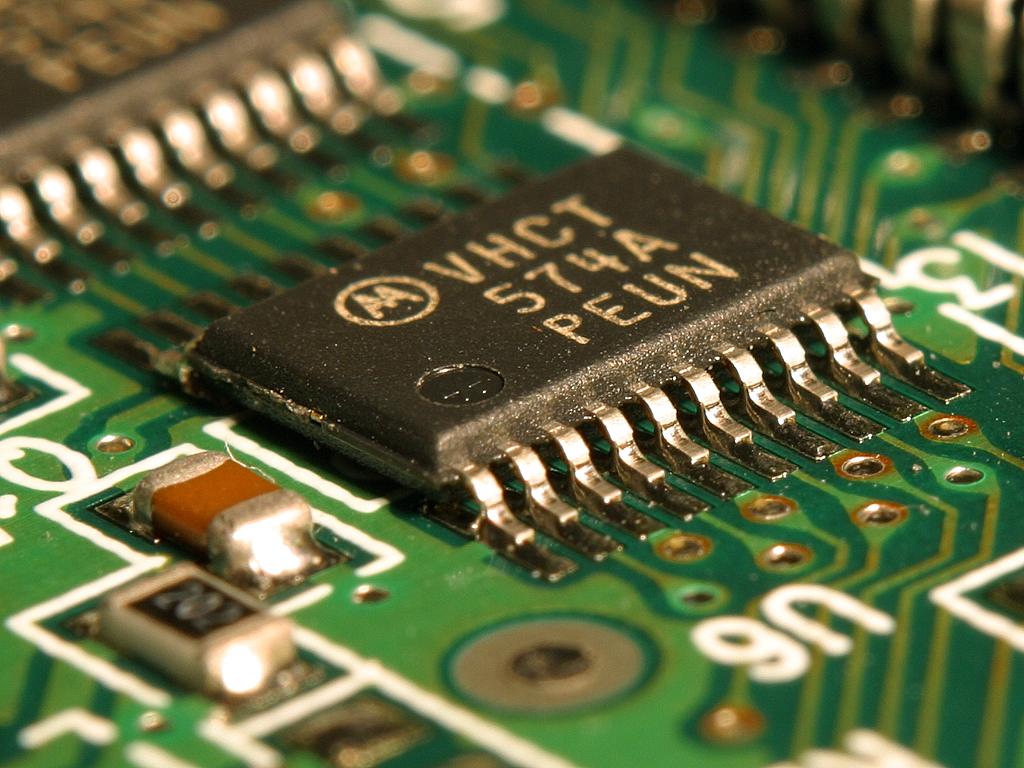 Close-up of an integrated circuit microchip used in AI inference hardware