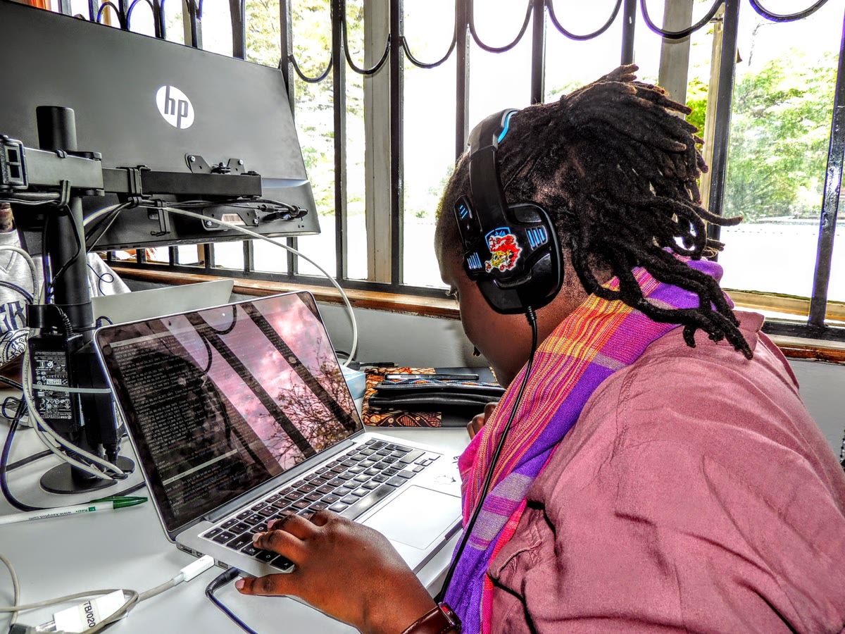 Developer working on a laptop at a desk, illustrating the GitHub Stacked PRs tutorial