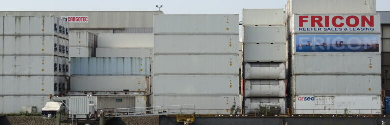 Shipping container stacks at the Port of Rotterdam, a visual metaphor for the npm supply chain