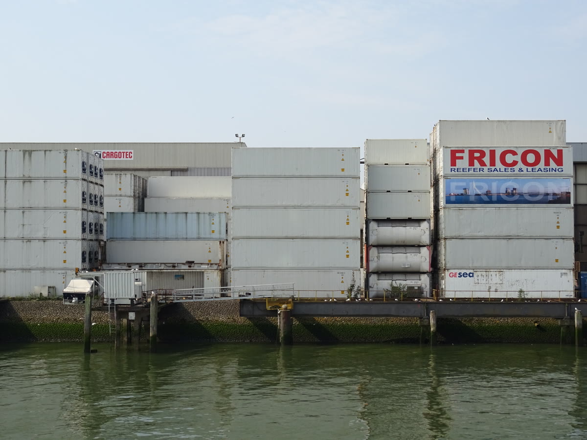 Shipping container stacks at the Port of Rotterdam, a visual metaphor for the npm supply chain