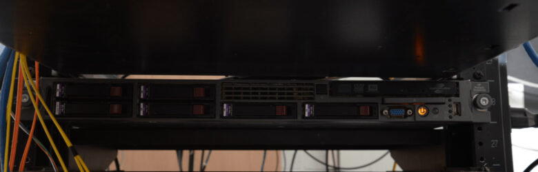 Server rack with hard drives and network cables in a data center, illustrating n8n automation infrastructure security