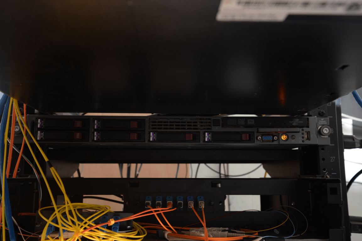 Server rack with hard drives and network cables in a data center, illustrating n8n automation infrastructure security