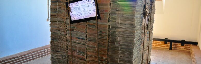 Stack of printed newspapers, representing the publishers whose web traffic is being reduced by AI search features