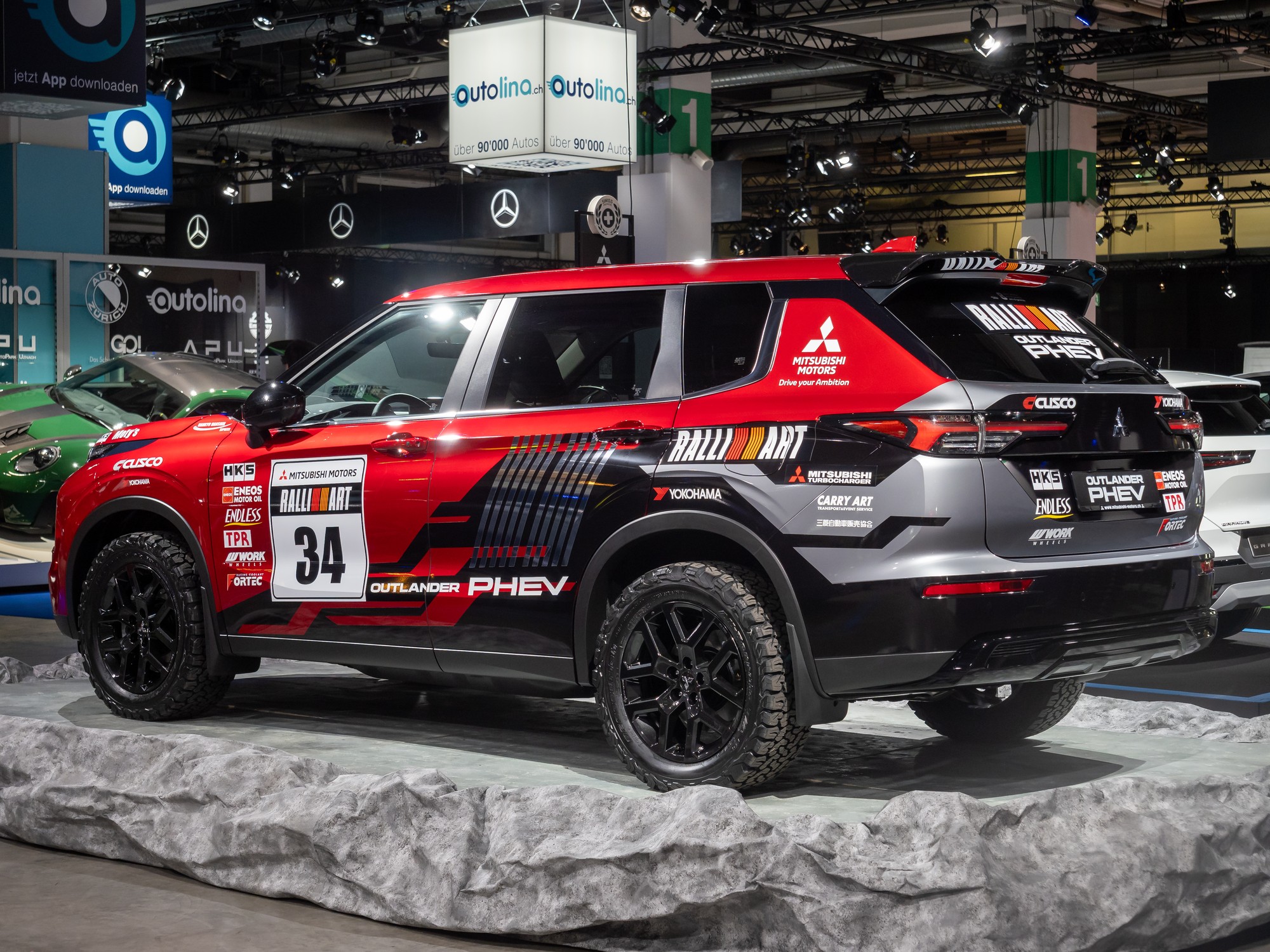 Mitsubishi Outlander GT PHEV plug-in hybrid SUV at an auto show