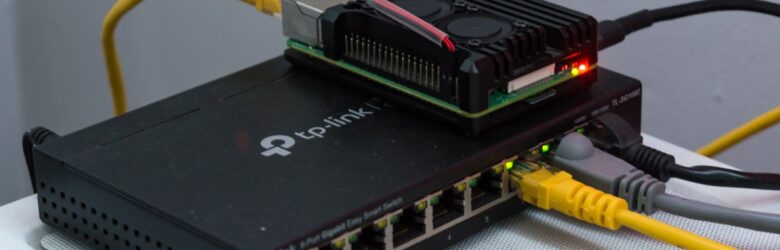 Raspberry Pi 4 sitting on a rackmount network switch, representing a local AI model router