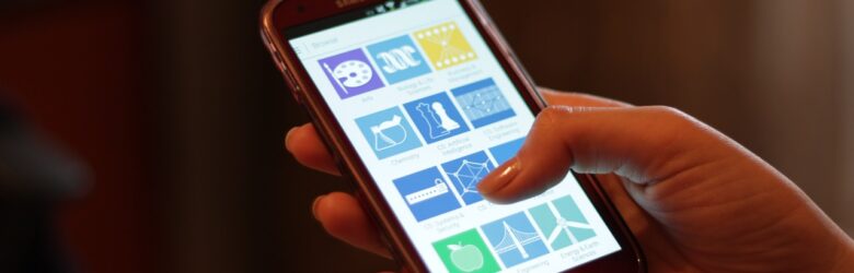 Person holding and using a smartphone