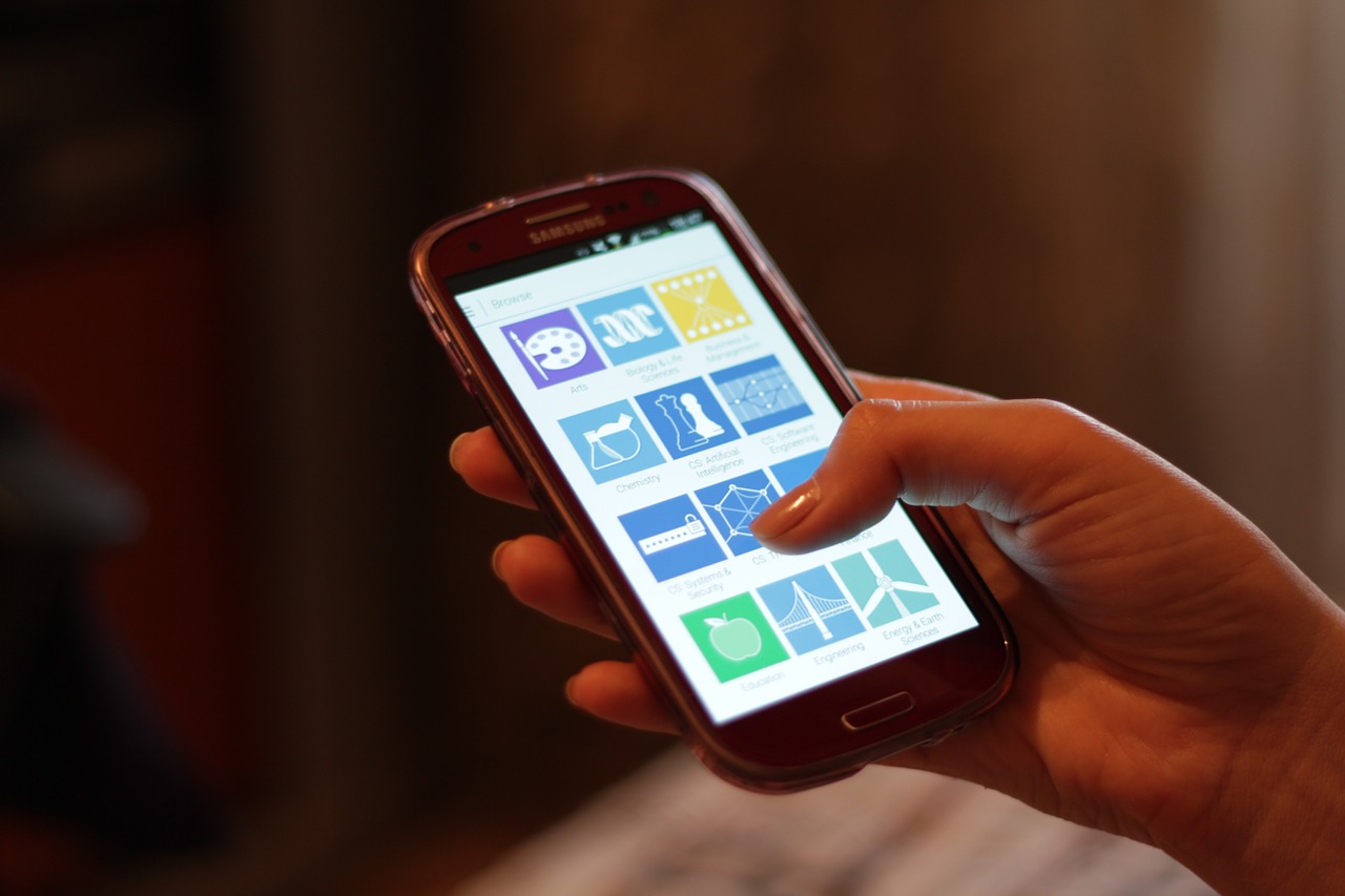Person holding and using a smartphone