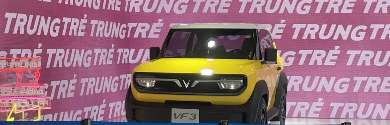 VinFast VF 3 electric city car on a street in Ho Chi Minh City - the VF 2 is its smaller, cheaper sibling