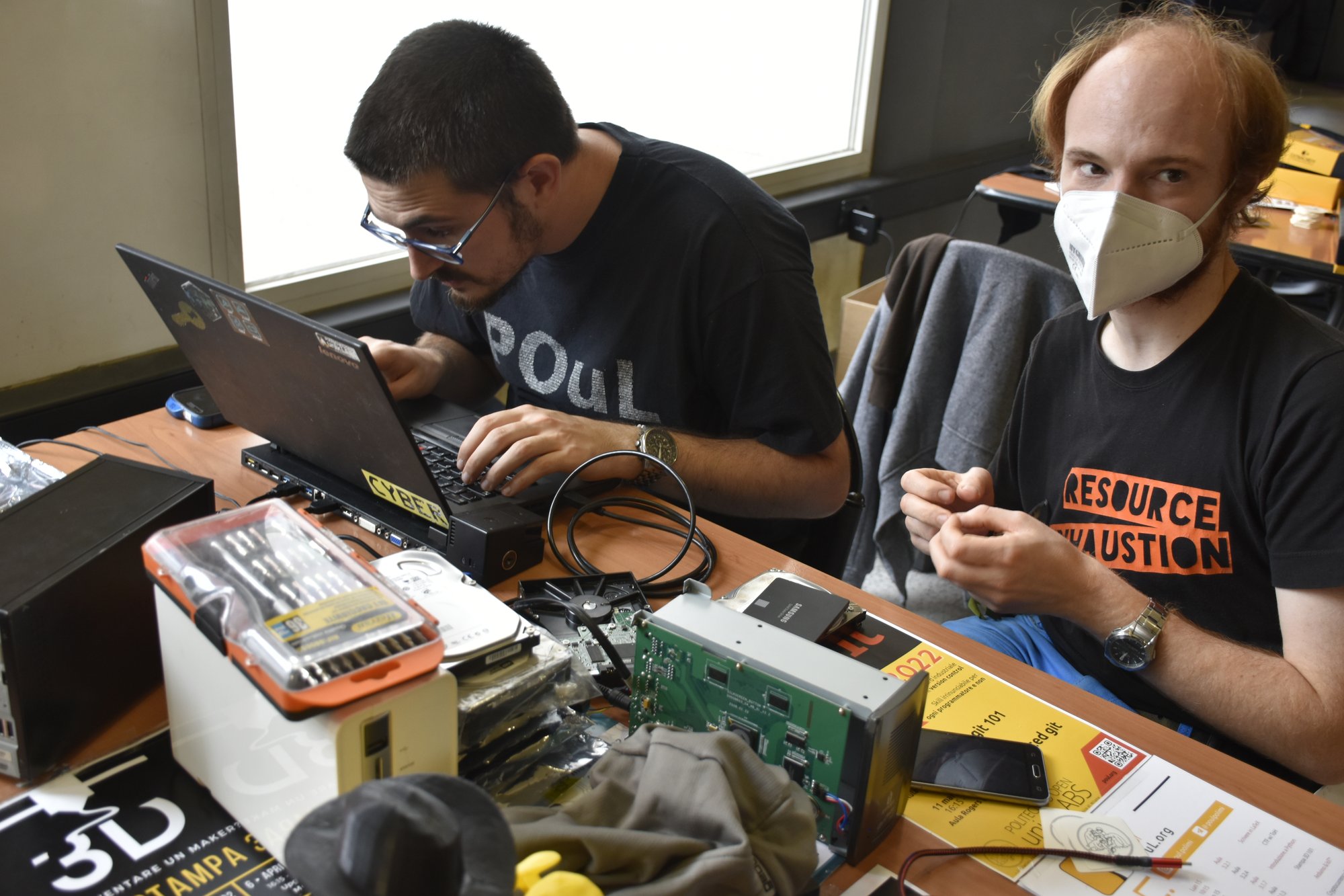 Hackers working on a Linux laptop representing AI security and transparency challenges