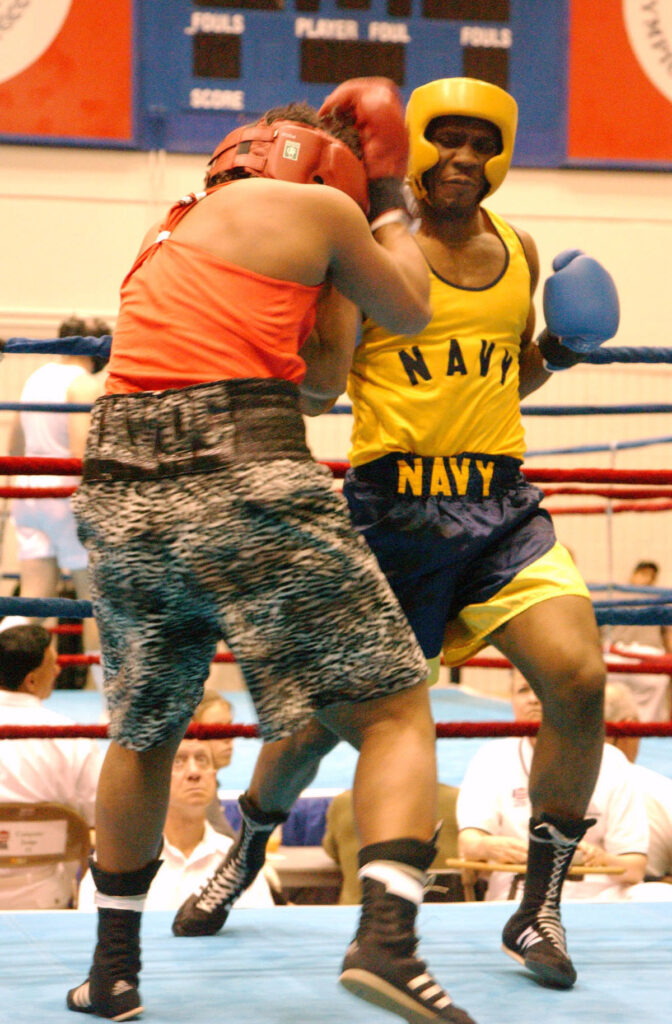Two boxers competing in a championship boxing ring