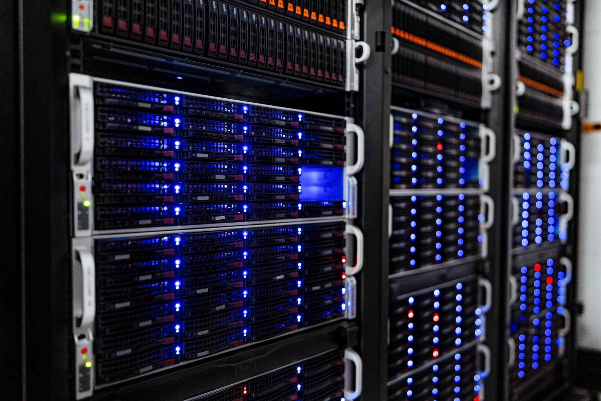 Rows of NOIRLab data center server racks representing AI control and monitoring infrastructure
