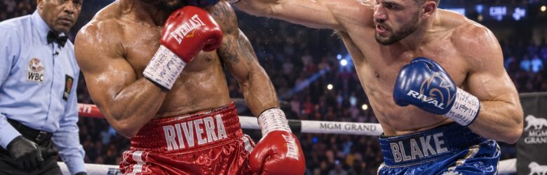 Two light heavyweight boxers exchanging punches in a boxing ring under arena lights
