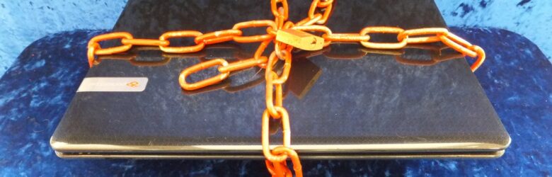Laptop with security lock representing endpoint protection