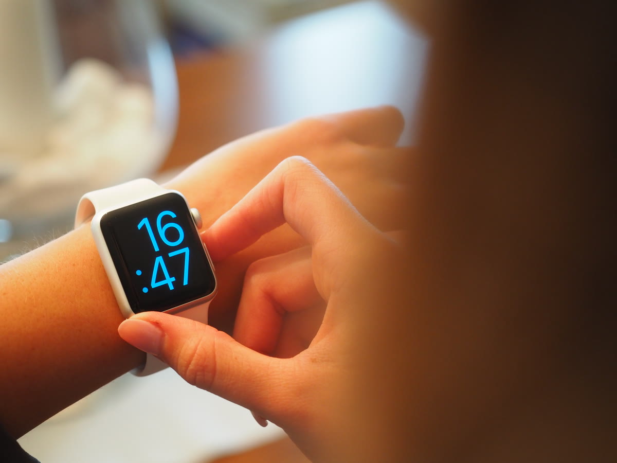 Smartwatch on a person's wrist displaying health metrics